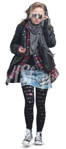 teenage girl in punk style outfit walking