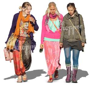 three hippie women walking together