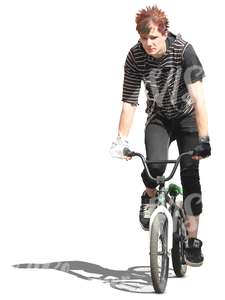 young man riding a bmx bike