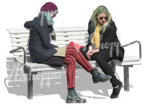 two punk women sitting on a bench