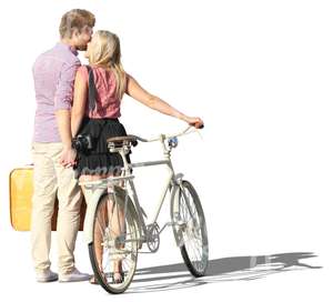 couple with a bike standing and kissing