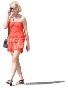 woman in a red dress talking on the phone