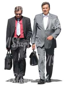 two businessmen with briefcases walking