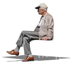 elderly man in a grey jacket sitting