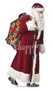 Santa Claus with a bag walking during Christmas