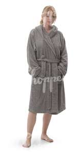 woman in a gray bathrobe standing 