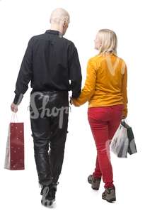 couple with shopping bags walking hand in hand