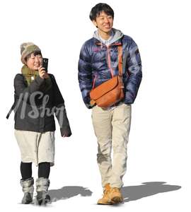 asian couple walking and taking pictures