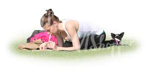 woman squatting on the grass and writing