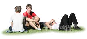 three young men having a picnic on the grass