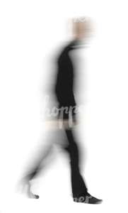 motion blur image of a man in black outfit walking