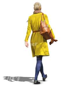 woman in a yellow coat walking