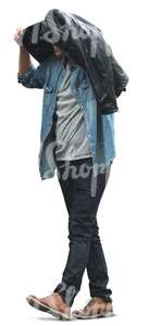 man walking and covering himself from the rain with his jacket
