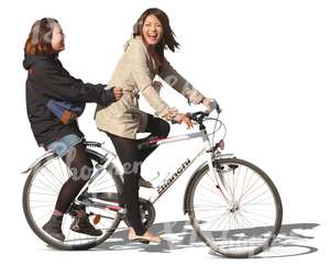 two laughing asian girls riding a bicycle