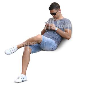 man with headphones sitting and listening to music