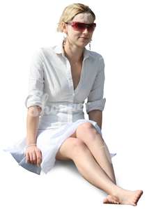 smiling young woman in a white dress sitting