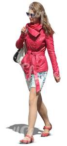 woman in a pink leather jacket walking