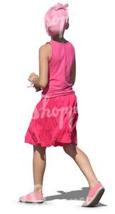 girl in a pink shirt and skirt walking