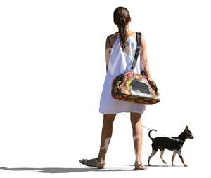 woman in a white dress walking a dog