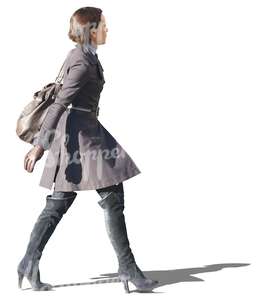 woman in a grey spring coat walking