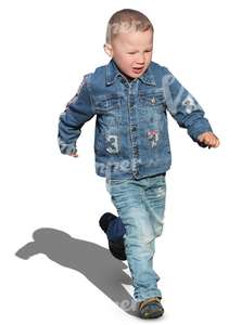 little boy in a denim outfit running around