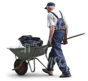 elderly man pushing a wheelbarrow