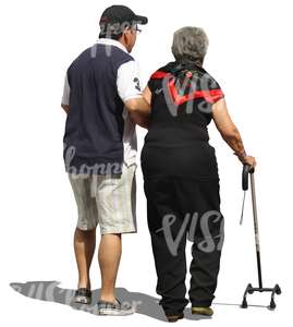 man helping a woman with a walking stick