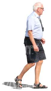 elderly man in shorts walking