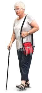 elderly woman walking with a walking stick