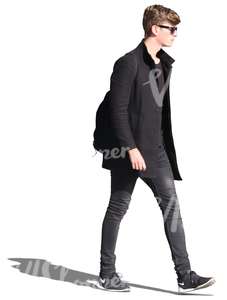 young man in black walking