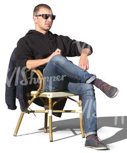 man sitting in a street cafe