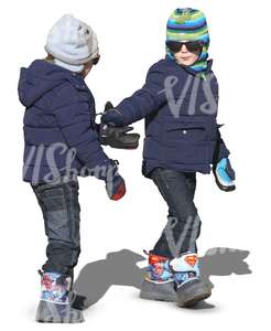 two kids in winter clothes walking