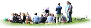 group of people sitting on the grass