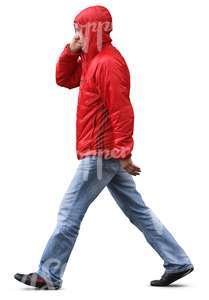 man in a red raincoat walking in the rain 