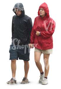 couple in raincoats walking hand in hand in the rain