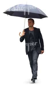 man with an umbrella walking in the rain
