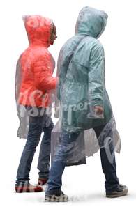 mother and daughter in rainjackets walking in the rain