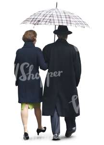 elderly couple walking in the rain under un umbrella