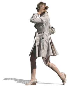 woman in a white coat walking