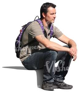 man with a backpack sitting