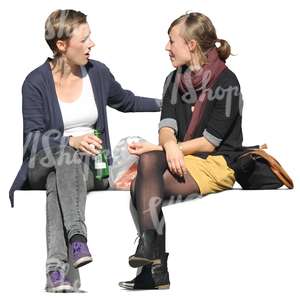 two women sitting and talking