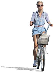 woman in denim shorts riding a bike