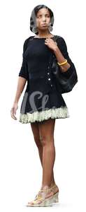 black woman in a black mini dress standing