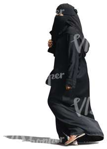 arab woman in a black abaya walking