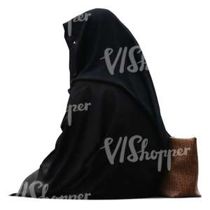 muslim woman in abaya sitting