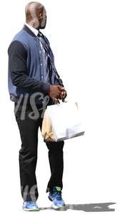 black man walking with shopping bags