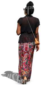 african woman in a long skirt walking