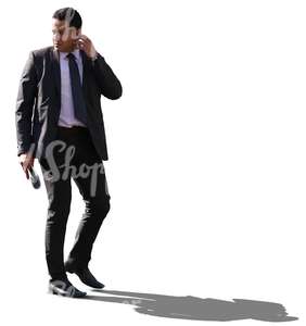 cut out backlit businessman walking