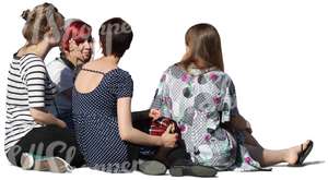 group of women sitting on the ground