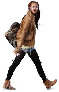 woman with long hair and a big bag walking